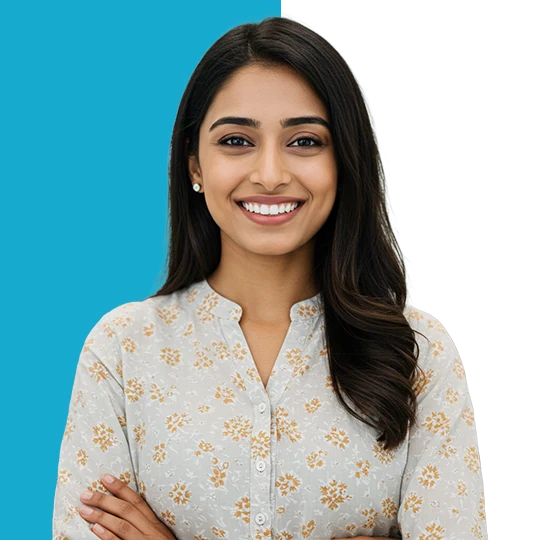 Confident Indian woman smiling with perfect teeth in a modern dental clinic, showcasing a healthy and happy smile.